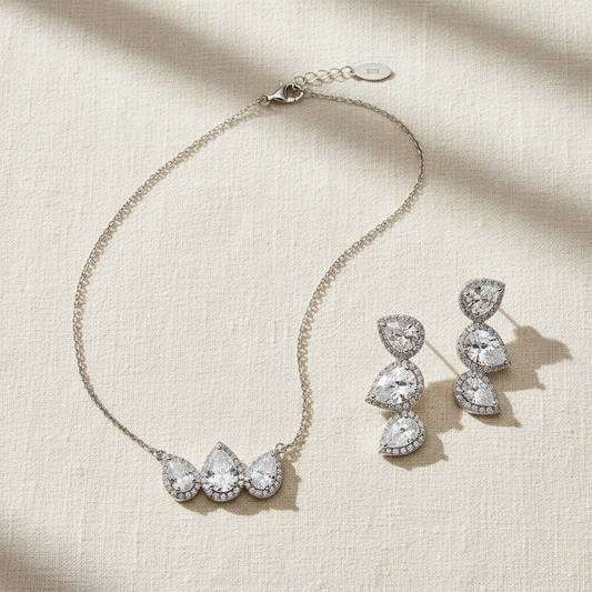 Triple Pear Halo CZ Set Overhead Flat Lay on Linen